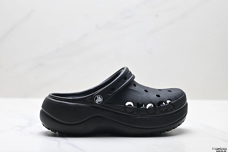 Black thick - soled Crocs clogs.
